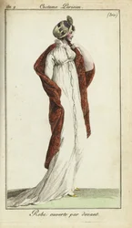 Femme à la mode avec un chapeau de paille, une robe et un châle