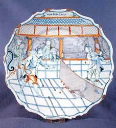 Assiette peinte avec une scène de tennis