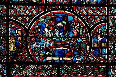 Vitrail représentant le Bon Samaritain et la Guilde des Tisserands