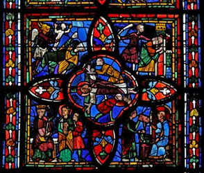Fenêtre représentant la deuxième section de la fenêtre w7 : au centre est la crucifixion de Saint Pierre ; ailleurs Saint Pierre devant Néron ; Saint Pierre emprisonné ; le diable prend une âme