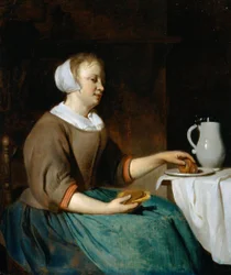Jeune femme mangeant à une table