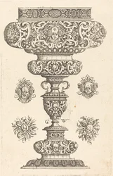 Gobelet, bord décoré de masque et bouquet de fruits