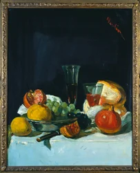 Raisins, citrons et grenades avec verres de vin blanc et pain
