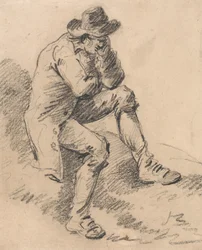 Homme assis sur une berge
