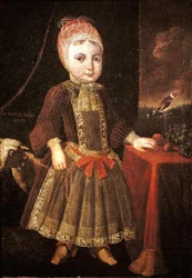 Intérieur avec une petite fille à une fenêtre