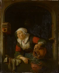 Une vieille femme arrosant un pot de roses