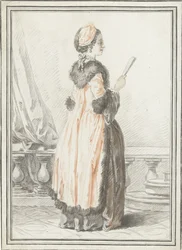 Femme debout avec éventail à la main