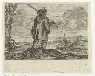 Paysage de dunes avec un homme, avec un bâton sur l