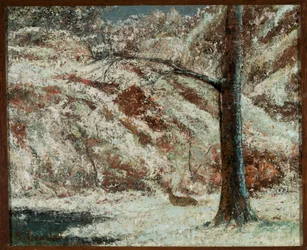 Un chevreuil dans la neige en forêt