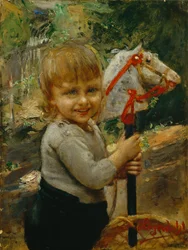Garçon avec cheval à bascule