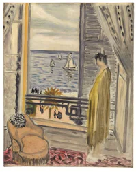 Femme auprès de la fenêtre