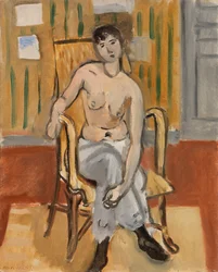 Nu assis dans une salle bronzée