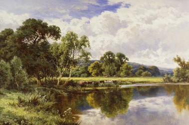 Paysage fluvial boisé avec du bétail