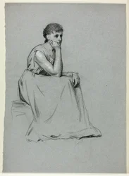 Femme assise se reposant sur son coude