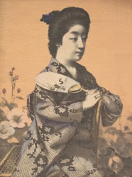 Fille portant un éventail rond en papier Uchiwa, vers 1900