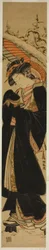 Jeune femme avec parapluie marchant dans la neige