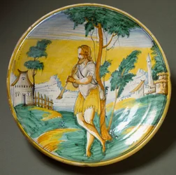 Joueur de flûte dans un paysage. Assiette en céramique produite à Viterbe, Italie. Fin du XVIe siècle. Florence, Museo Nazionale del Bargello