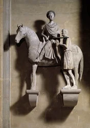 Saint Martin à cheval partageant son manteau avec un mendiant. Sculpture