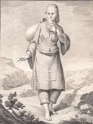 Une femme arabe puisant de l