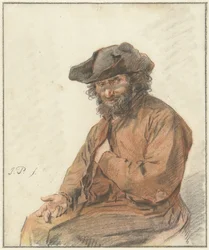 Homme assis aux longs cheveux bouclés et chapeau noir