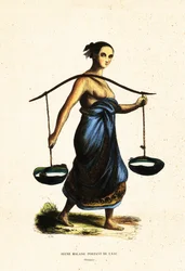 Jeune femme malaise portant des seaux d