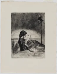Lecture à la lumière de la lampe