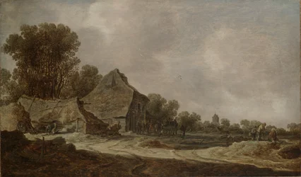 Un chemin sablonneux avec des cottages au toit de chaume