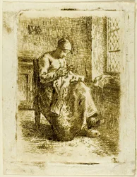 Une femme cousant