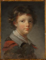 Un garçon dans un manteau doublé de rouge