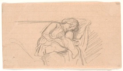 Femme avec enfant sur les genoux, assise sur un canapé