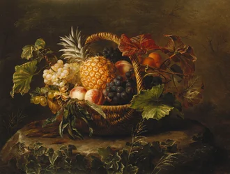 Ananas, raisins, pêches et abricots dans un panier