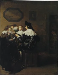 Compagnie avec un homme jouant du luth, assis à une table