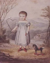 Fille avec un cheval jouet
