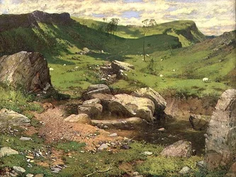 Un ruisseau rocheux dans un paysage montagneux