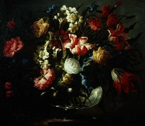 Tulipes, œillets et narcisses dans un vase en verre