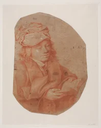Jeune homme lisant avec un foulard enroulé autour de la tête