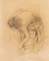 Nu féminin chaussant ses chaussures