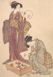 Deux femmes nourrissant des poissons