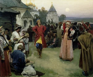 Danse (un couple de jeunes mariés en costume traditionnel danse parmi la foule des villageois à la tombée de la nuit)