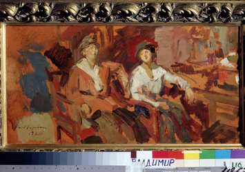 Deux sur les chaises en osier