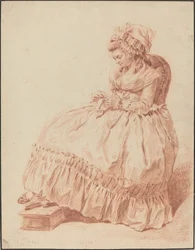 Femme assise cousant