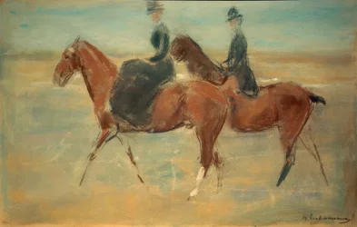Cavalier et cavalière au bord de la mer