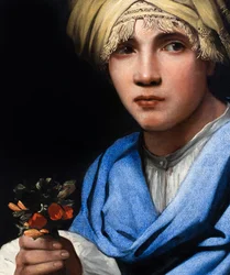 Garçon avec turban tenant un bouquet de fleurs