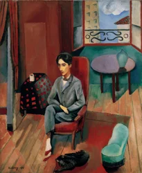 Jean Cocteau assis dans son atelier