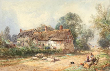 Cottage au toit de chaume sur une voie