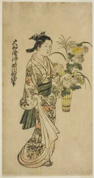 Jeune fille portant une composition florale