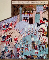Empire ottoman : représentation du sultan Soliman le Magnifique (1520-1566) et de son armée attaquant une ville fortifiée. Miniature tirée du 