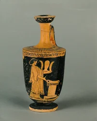 Femme devant un autel. Petit lécythe à figures rouges...