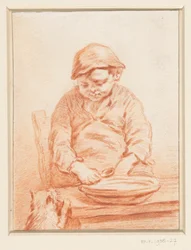 Garçon mangeant de la bouillie, avec un chat