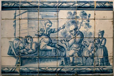 Le médecin faisant un lavement à un patient - Panneau satirique de Lisbonne, première moitié du XVIIIe siècle - Musée national des azulejos, Lisbonne (Portugal)